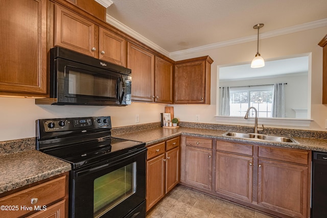 kitchen with pendant lighting, sink, ornamental molding, and black appliances