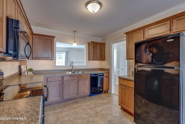 kitchen featuring sink, a textured ceiling, ornamental molding, pendant lighting, and black appliances