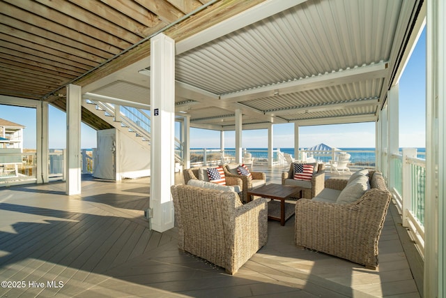 deck featuring an outdoor hangout area and a water view