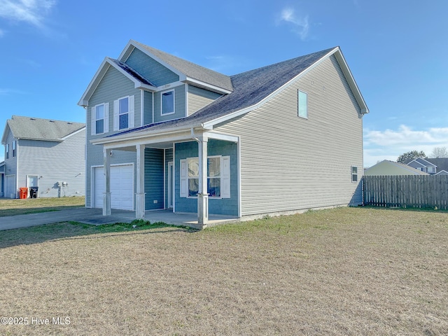 view of front of house featuring a garage, a front lawn, and a porch