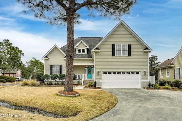 3566 Sanderling Dr SE, Southport, NC 28461 - traditional-style home with concrete driveway, an attached garage, a front lawn, and a shingled roof