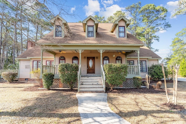 cape cod-style house with a porch, crawl space, and a shingled roof