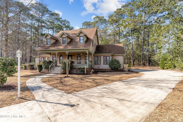 cape cod-style house with a porch