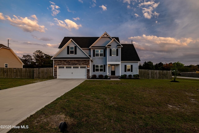 craftsman inspired home featuring fence, a lawn, driveway, and a garage