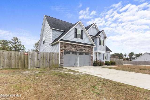 view of front facade featuring a garage and a front lawn