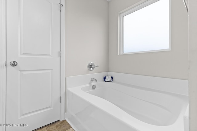 bathroom featuring a garden tub