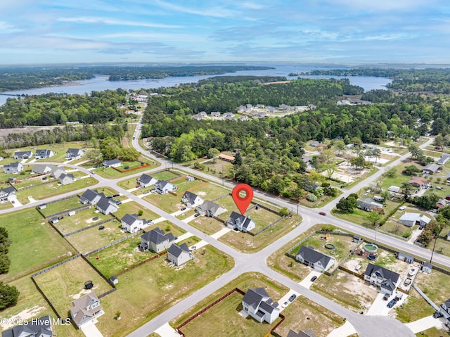 drone / aerial view with a residential view and a water view