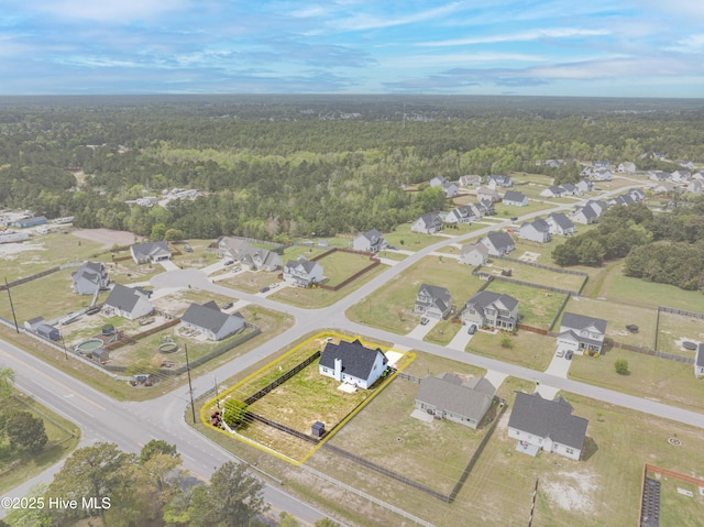 bird's eye view featuring a residential view and a view of trees