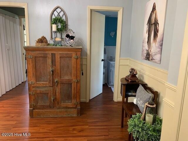 hallway with dark hardwood / wood-style flooring