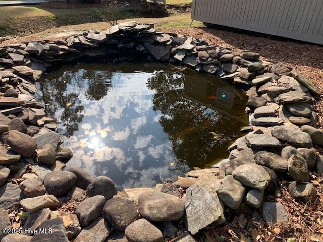 exterior space with a small pond