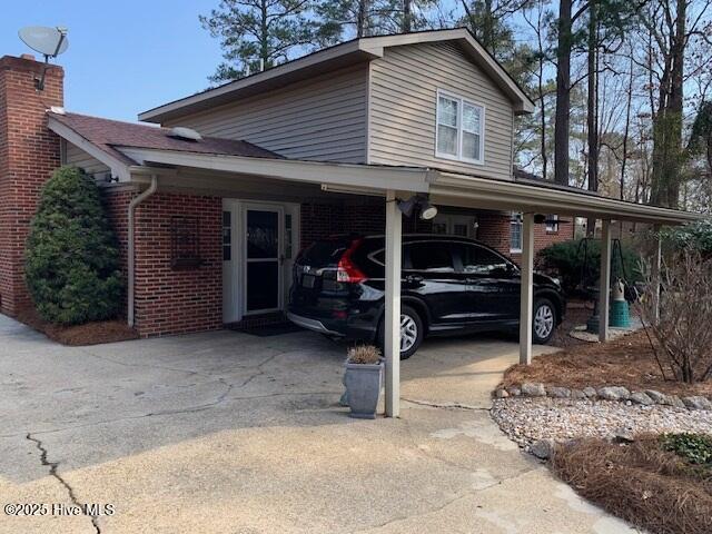 exterior space featuring a carport