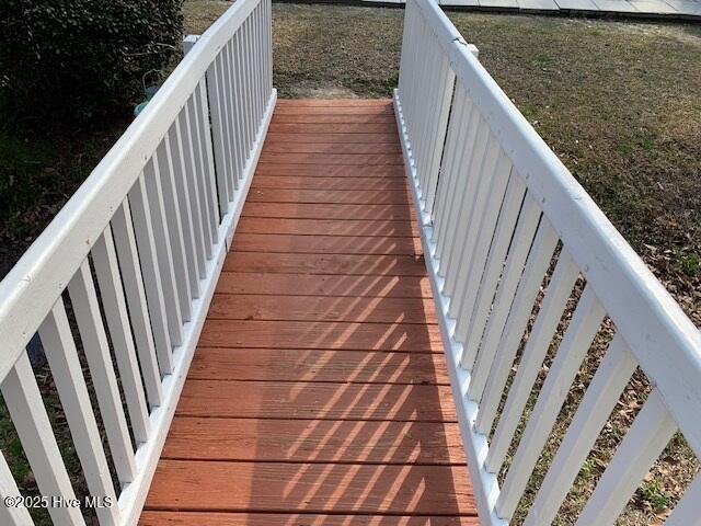 wooden terrace with a yard