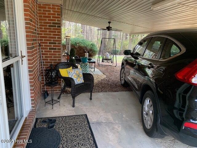 view of patio featuring ceiling fan