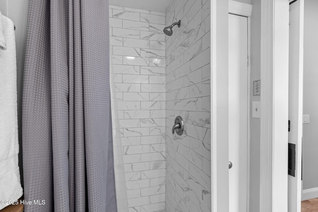 bathroom with a shower with shower curtain