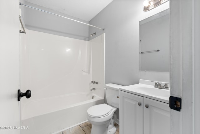 bathroom featuring vanity, toilet, and shower / bathtub combination