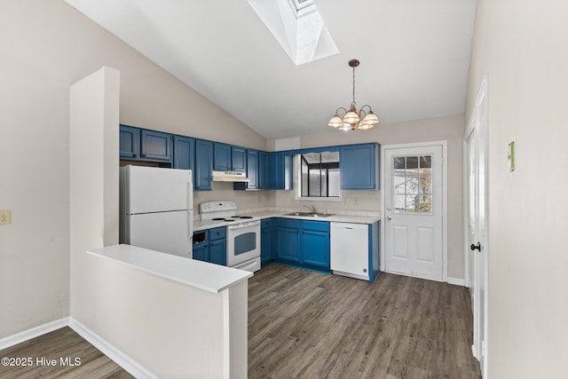 kitchen featuring white appliances, blue cabinetry, a sink, light countertops, and under cabinet range hood