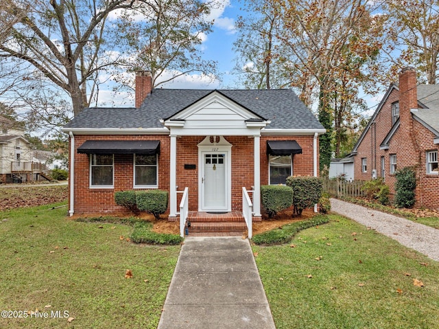 bungalow-style home featuring a front yard