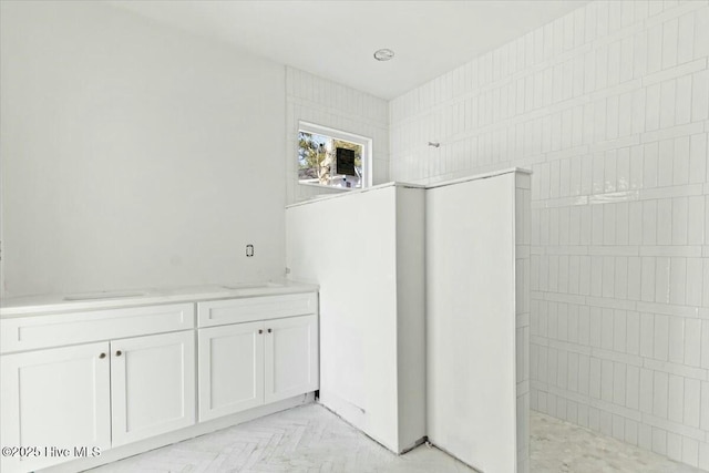 bathroom featuring parquet floors