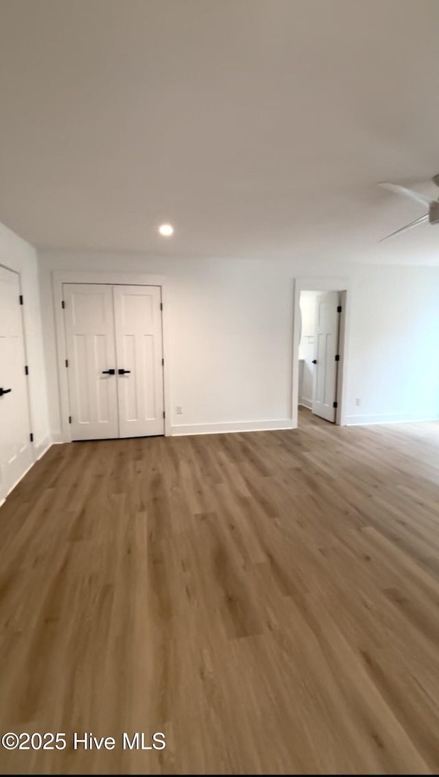 1643 Deerfield Dr SW, Ocean Isle Beach, NC 28469 - unfurnished living room featuring wood finished floors, recessed lighting, and ceiling fan