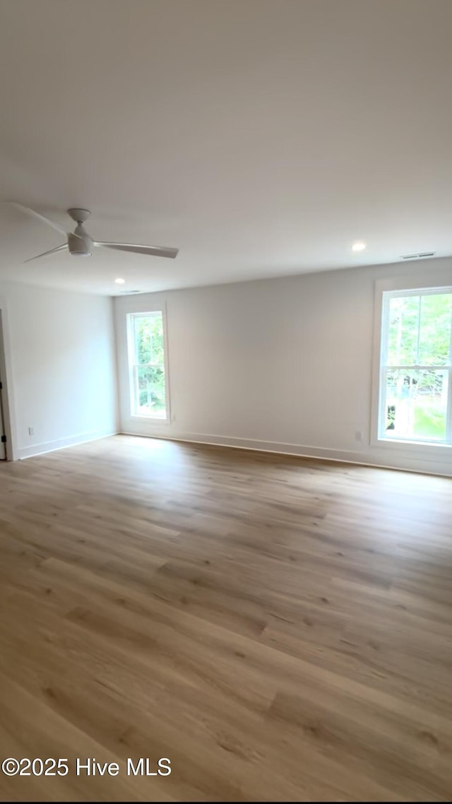 1643 Deerfield Dr SW, Ocean Isle Beach, NC 28469 - spare room featuring wood finished floors, ceiling fan, and recessed lighting