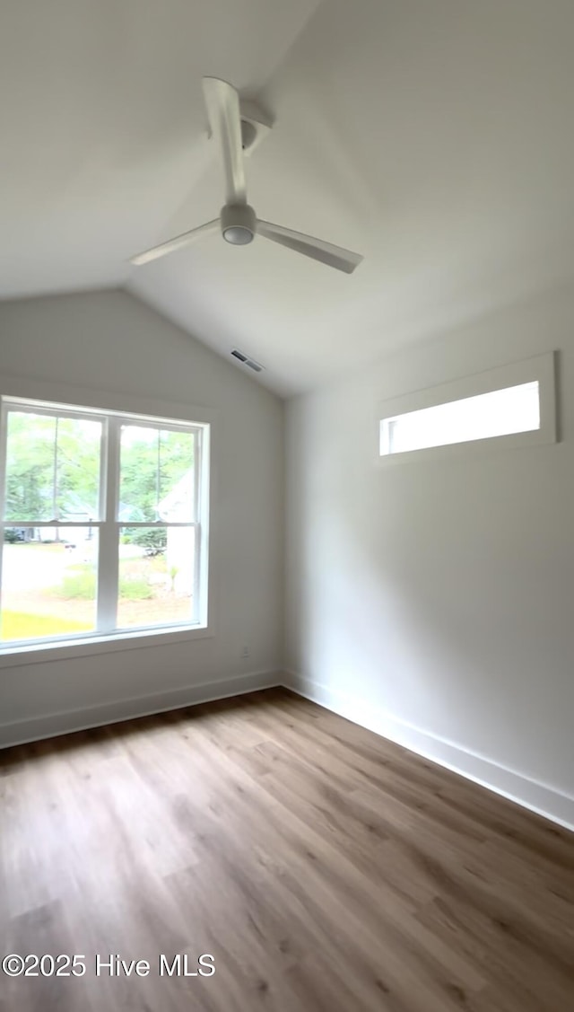 1643 Deerfield Dr SW, Ocean Isle Beach, NC 28469 - spare room with ceiling fan, plenty of natural light, wood finished floors, and lofted ceiling