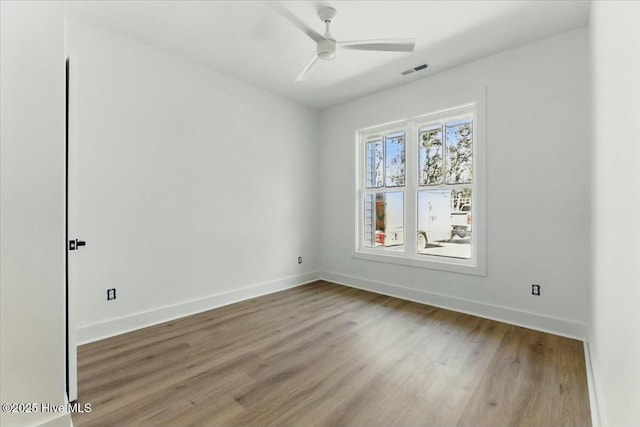 1643 Deerfield Dr SW, Ocean Isle Beach, NC 28469 - empty room featuring wood finished floors and a ceiling fan