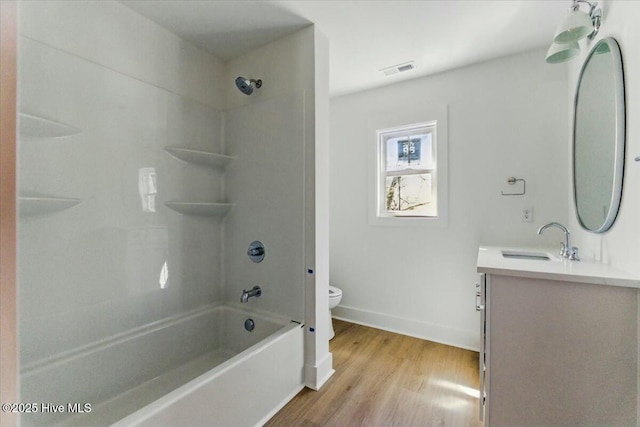 1643 Deerfield Dr SW, Ocean Isle Beach, NC 28469 - bathroom with vanity, wood finished floors, and shower / tub combination