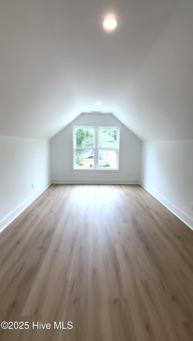 1643 Deerfield Dr SW, Ocean Isle Beach, NC 28469 - bonus room featuring wood finished floors, vaulted ceiling, and recessed lighting