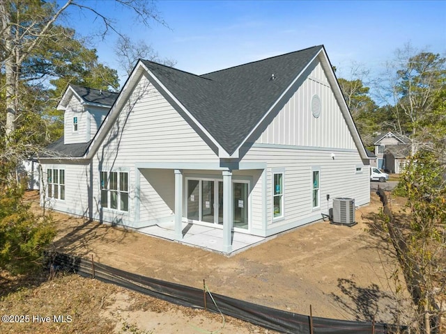 back of property with central air condition unit and a patio area