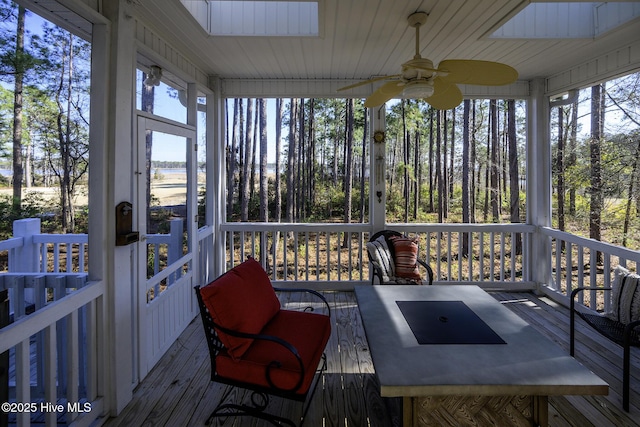 sunroom / solarium with ceiling fan