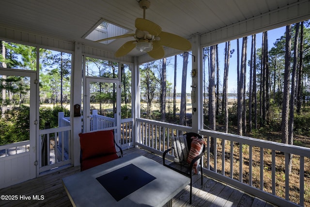 sunroom with a ceiling fan