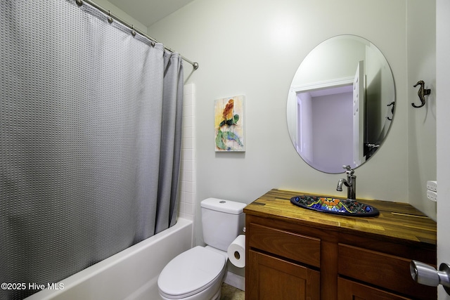 bathroom featuring vanity, toilet, and shower / bathtub combination with curtain