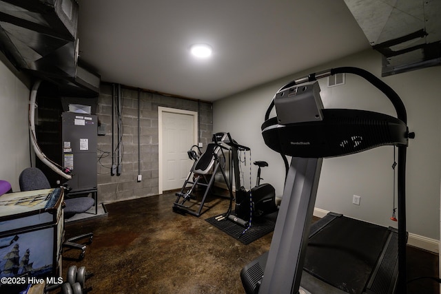 workout room with concrete block wall