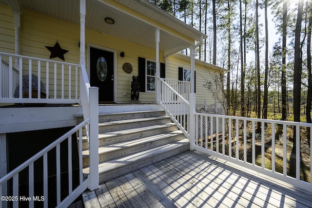 wooden terrace with a porch