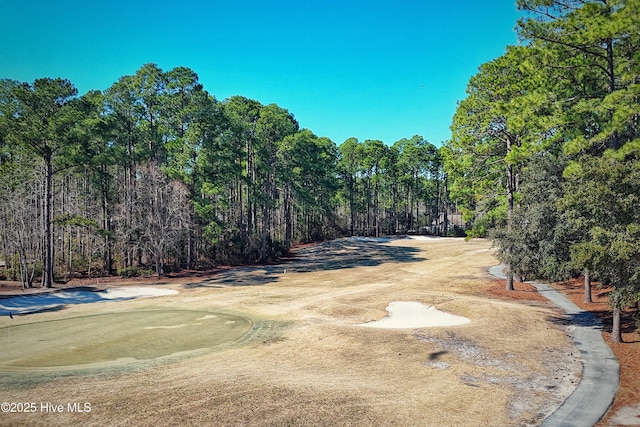 surrounding community featuring view of golf course