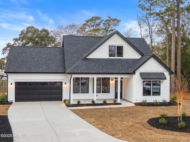 1773 Oakbrook Dr SW, Ocean Isle Beach, NC 28469 - modern inspired farmhouse with board and batten siding, a garage, a front yard, a shingled roof, and concrete driveway