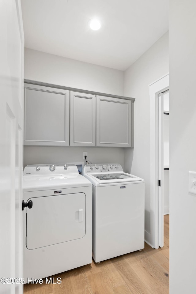 1773 Oakbrook Dr SW, Ocean Isle Beach, NC 28469 - clothes washing area featuring recessed lighting, light wood-style floors, independent washer and dryer, and cabinet space