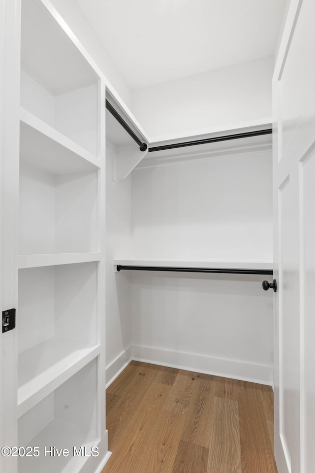 1773 Oakbrook Dr SW, Ocean Isle Beach, NC 28469 - walk in closet featuring wood finished floors
