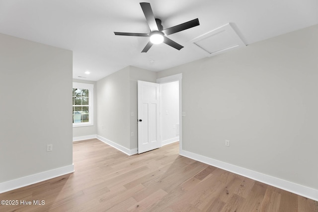 1773 Oakbrook Dr SW, Ocean Isle Beach, NC 28469 - empty room with baseboards, light wood-type flooring, attic access, and ceiling fan