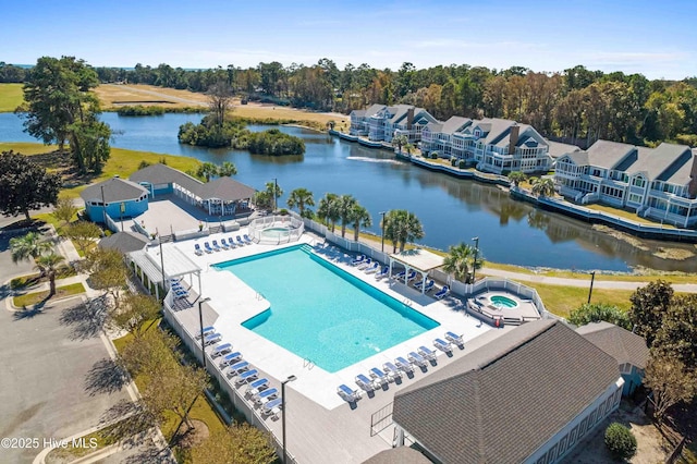 1773 Oakbrook Dr SW, Ocean Isle Beach, NC 28469 - pool featuring a water view, a patio, and a hot tub