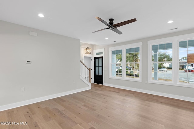 1773 Oakbrook Dr SW, Ocean Isle Beach, NC 28469 - unfurnished living room featuring light wood-style flooring, recessed lighting, and baseboards