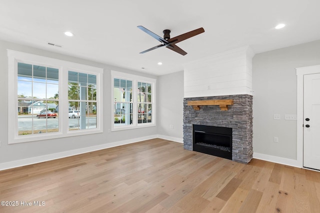1773 Oakbrook Dr SW, Ocean Isle Beach, NC 28469 - unfurnished living room featuring light wood-style flooring, a ceiling fan, recessed lighting, and a fireplace