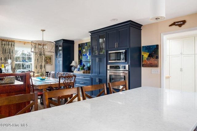 dining area featuring an inviting chandelier