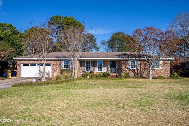 ranch-style home featuring aphalt driveway, a front yard, brick siding, and a garage