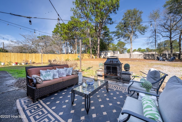 view of patio featuring an outdoor hangout area and a fenced backyard