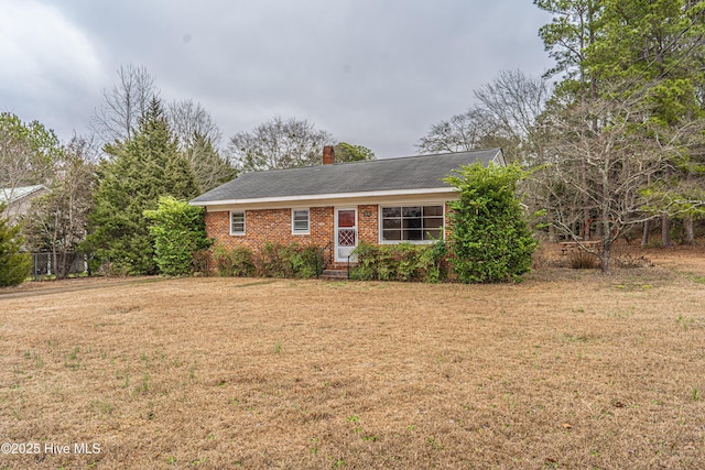 ranch-style home with a front lawn