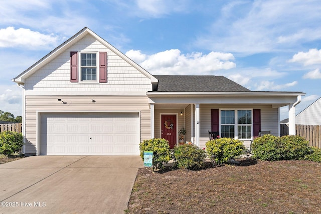 traditional-style home with fence, concrete driveway, and a porch