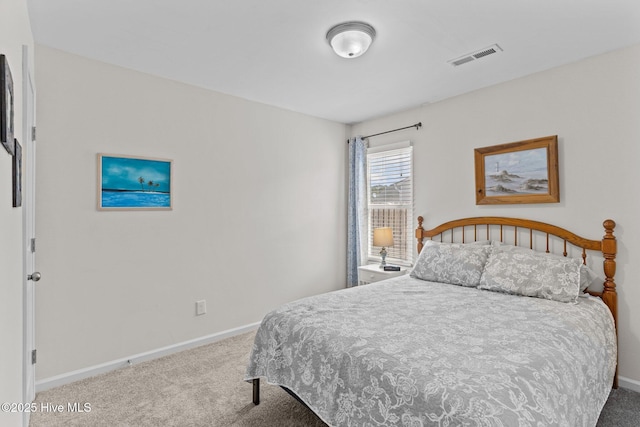 bedroom featuring baseboards, visible vents, and carpet