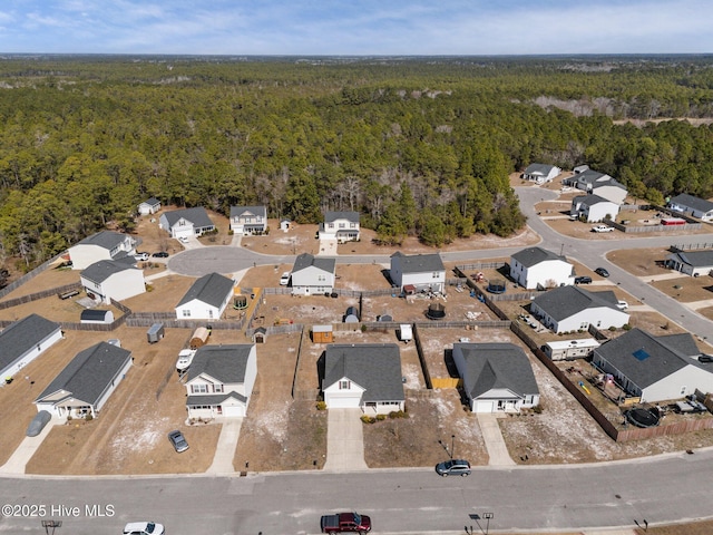aerial view featuring a residential view and a forest view