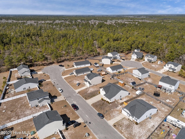 bird's eye view with a residential view and a forest view
